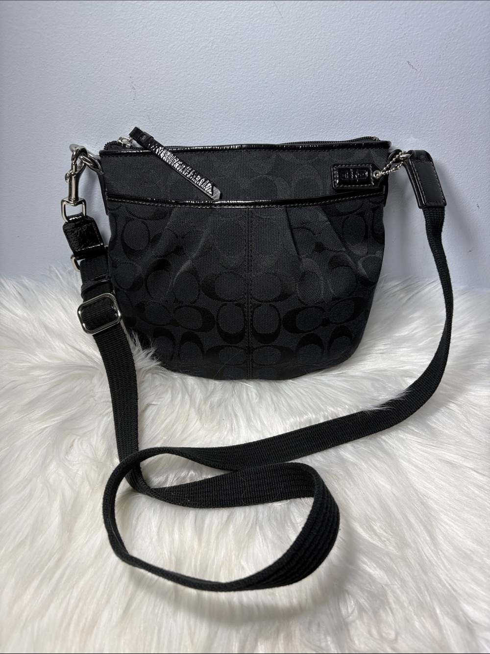 Coach signature jacquard pleated swingpack crossbody bag.
